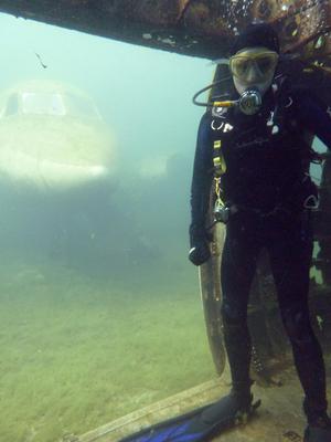 Inside the helicopter, in front of airplane