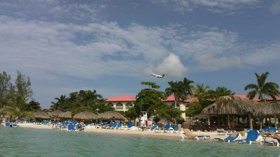 Airplane flying over Sandals Montego Bay, Jamaica